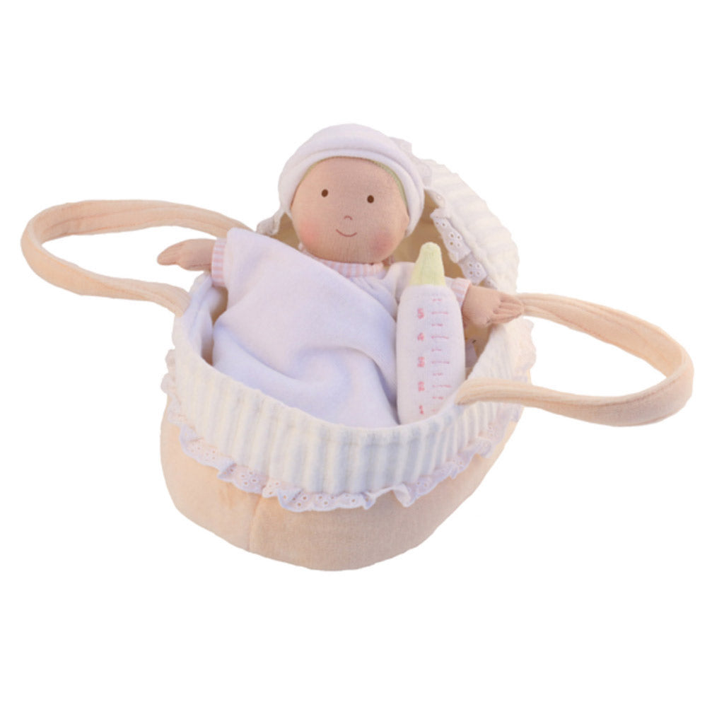 A personalised Bonikka rag doll baby in a cot with large carrying loops.  