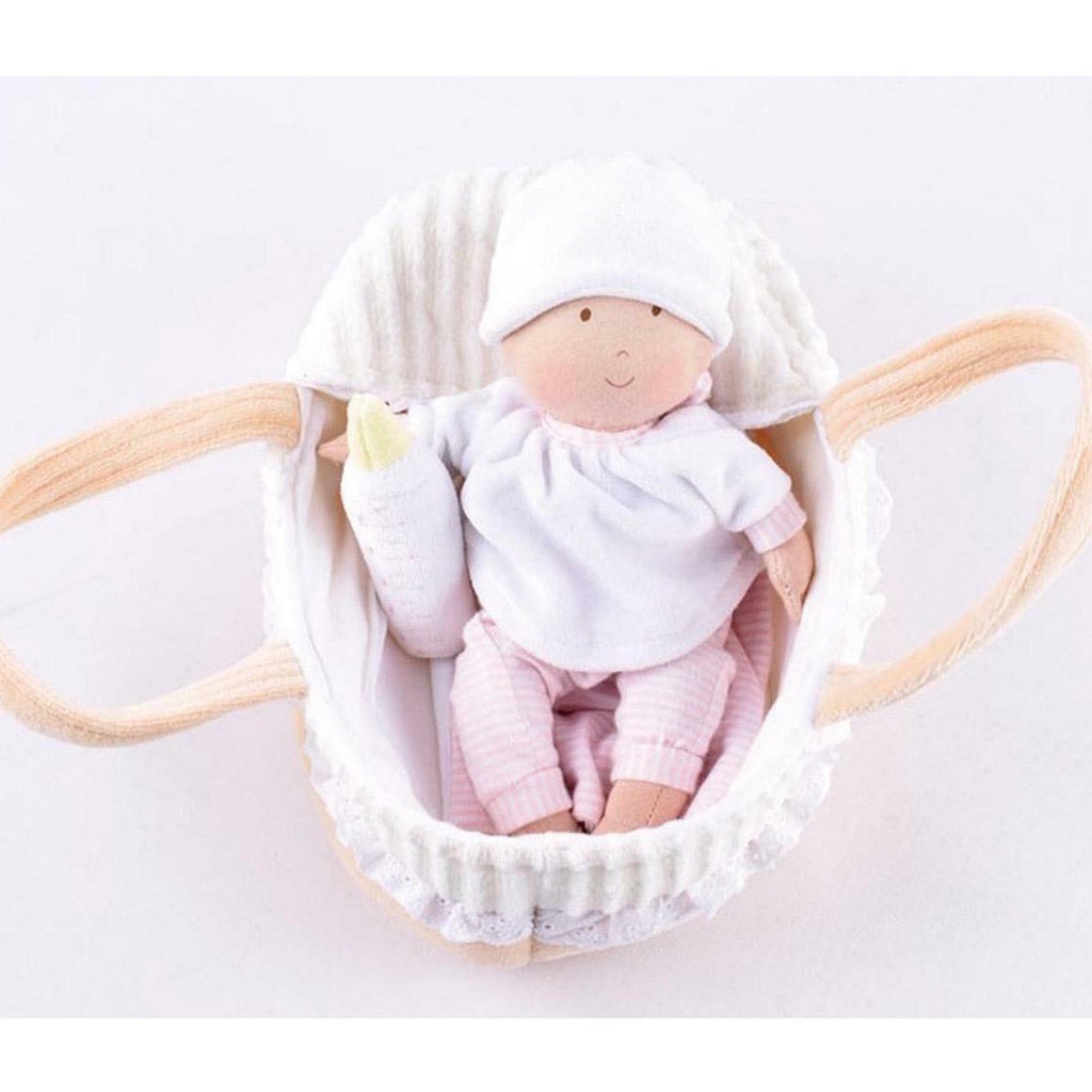 Front view of a personalised Bonikka rag doll baby in a cot with large carrying loops.  