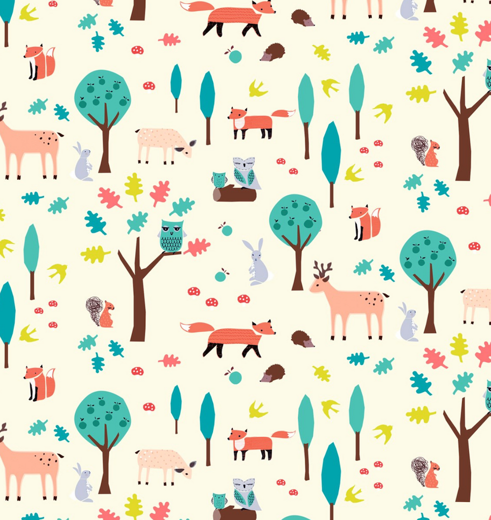 Close up of Whimsical Woodland Gift Wrapping Paper with tree, foxes and owls for Christmas, Birthdays and Christenings