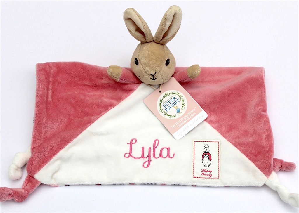 A white and pink Beatrix Potter Flopsy Bunny Comforter showing a personalised name
