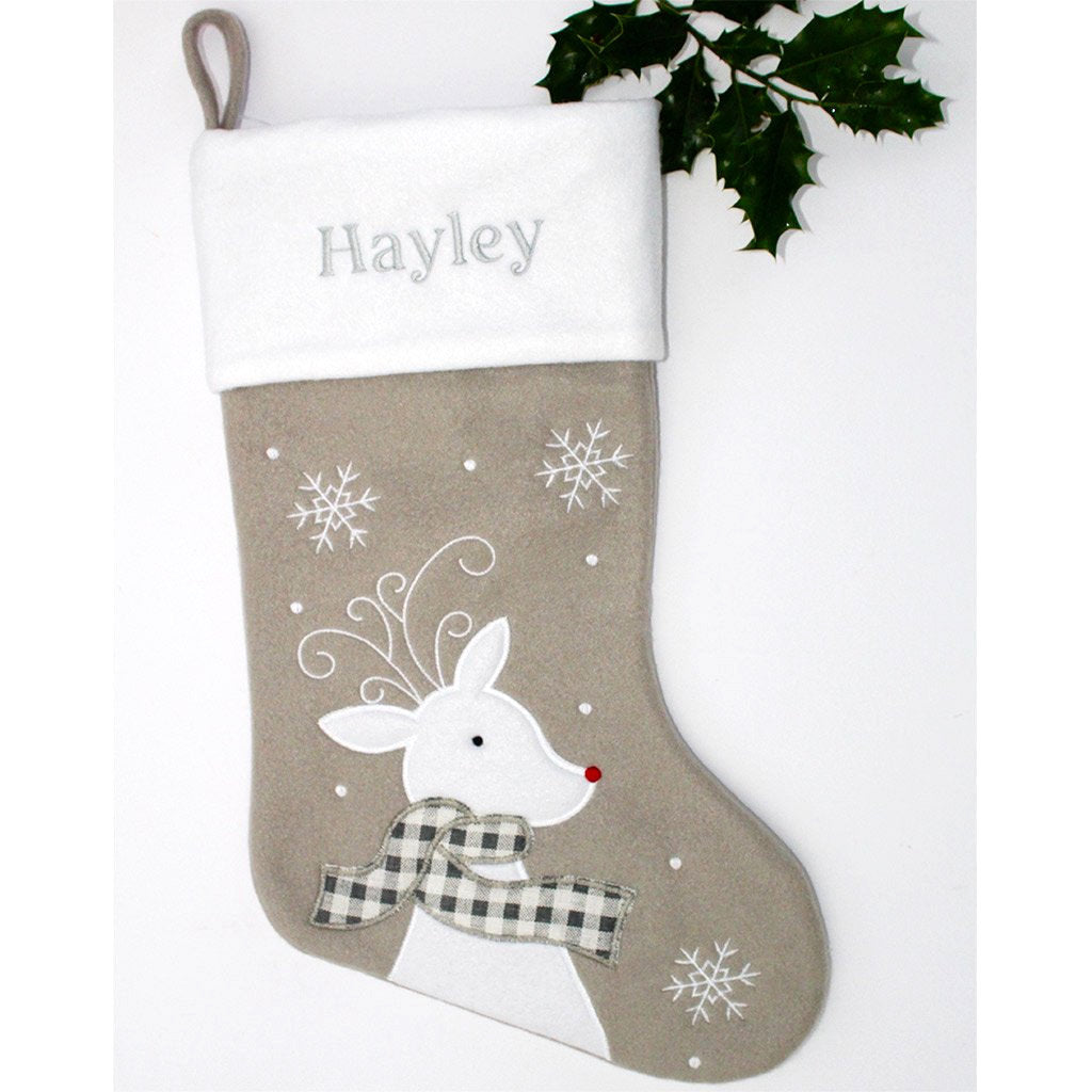 A personalised grey Christmas stocking with white deer, snow and name above