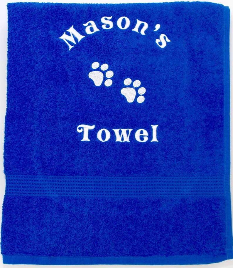 A large blue Personalised pet Cat bath Towel with name and pet paws