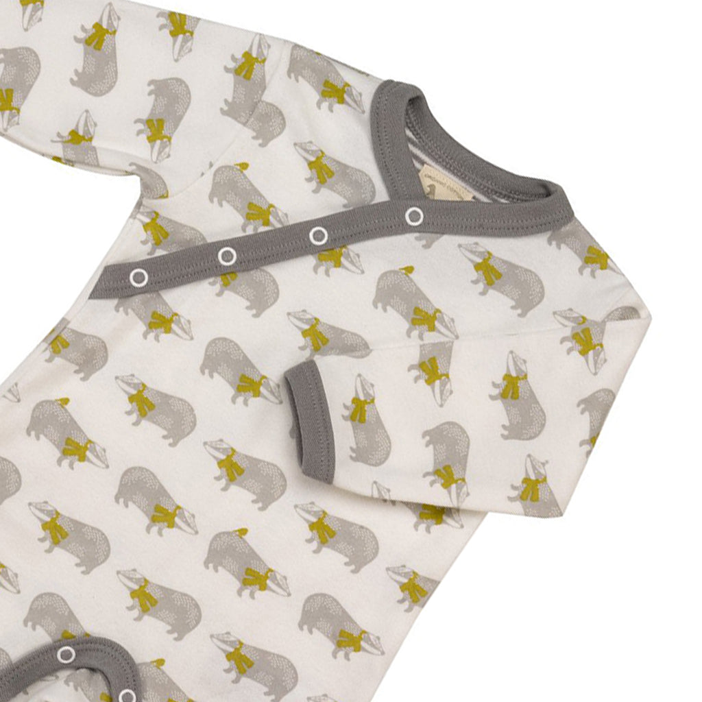 close up of a top quality organic Badger Romper from Pigeon Organics - grey, white and mustard colours 