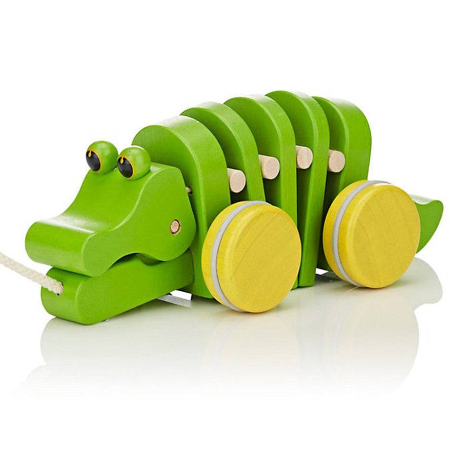 Plan Toys Eco Friendly Dancing Alligator is green with yellow wheels