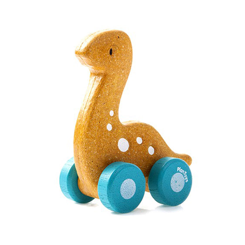 Plan Toys Dino Car Diplo eco friendly toy for children. Has blue wheels and white spotted body