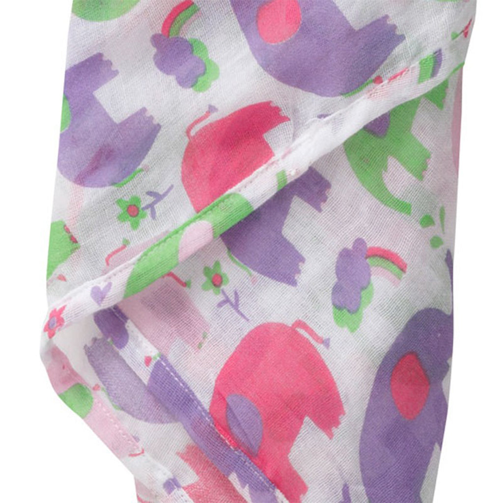 close up of the  Organic piccalilly pink purple and green elephant muslin swaddle for baby girls