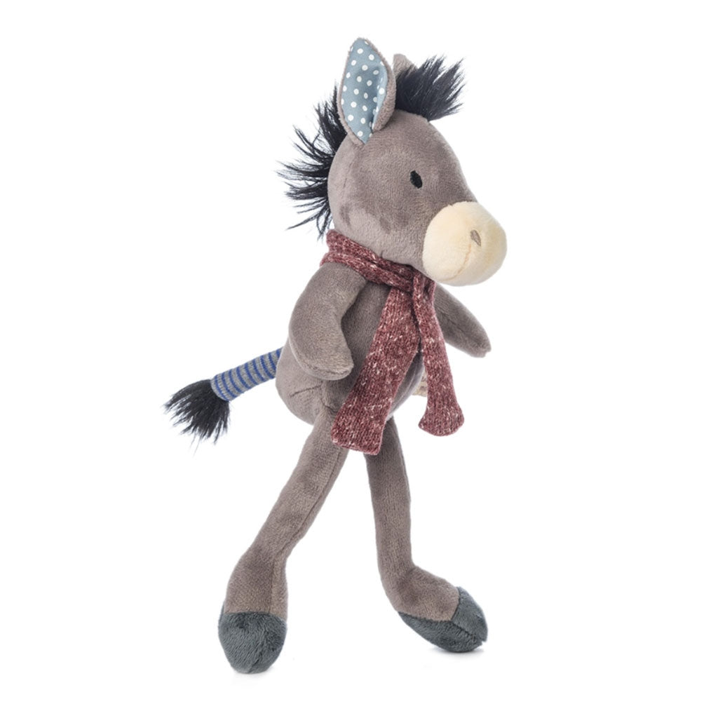 Side view of Ragtales Pedro the Donkey who has a cosy knitted scarf, mismatched ears, a stripy tail and a soft furry mane.