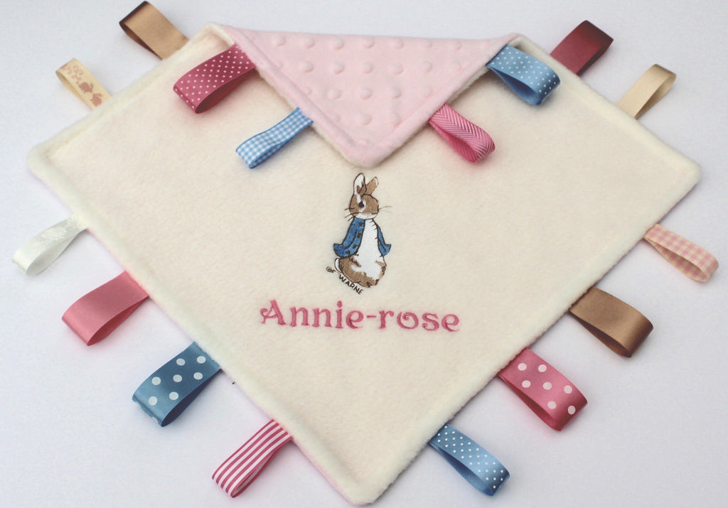 Beatrix Potter Peter Rabbit Taggy with pink and blue ribbons and showing back side