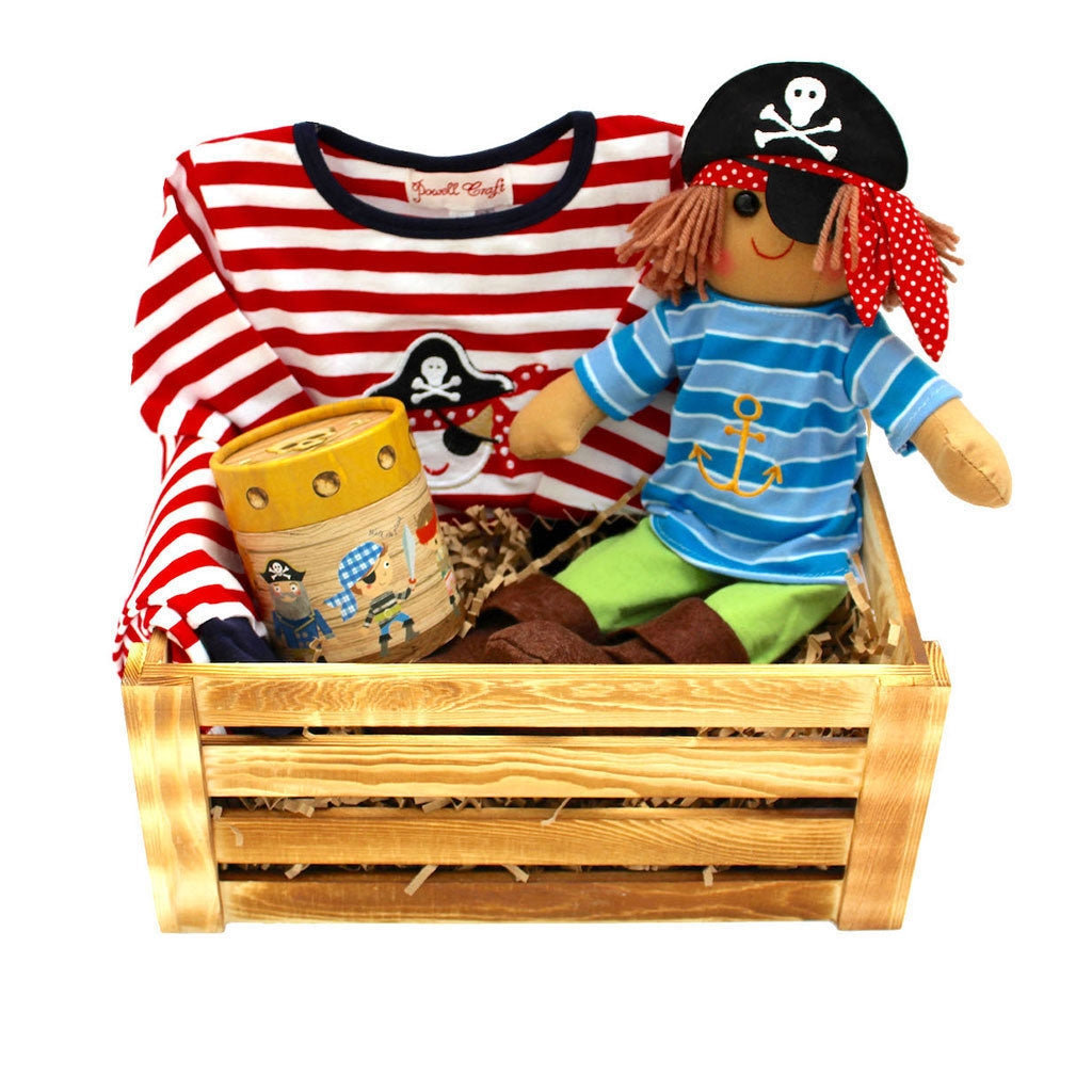 Hedgehog Gifts children gift hamper with pirate themed items including money box, Pirate Rag Doll, and Red and white striped cotton Pyjamas with an appliquéd pirate face.