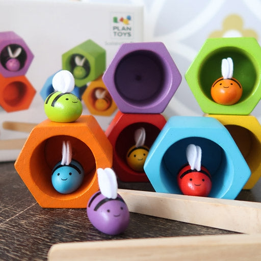 Plan toys eco friendly sustainable multi coloured hives and bees and a pair of wooden tweezers