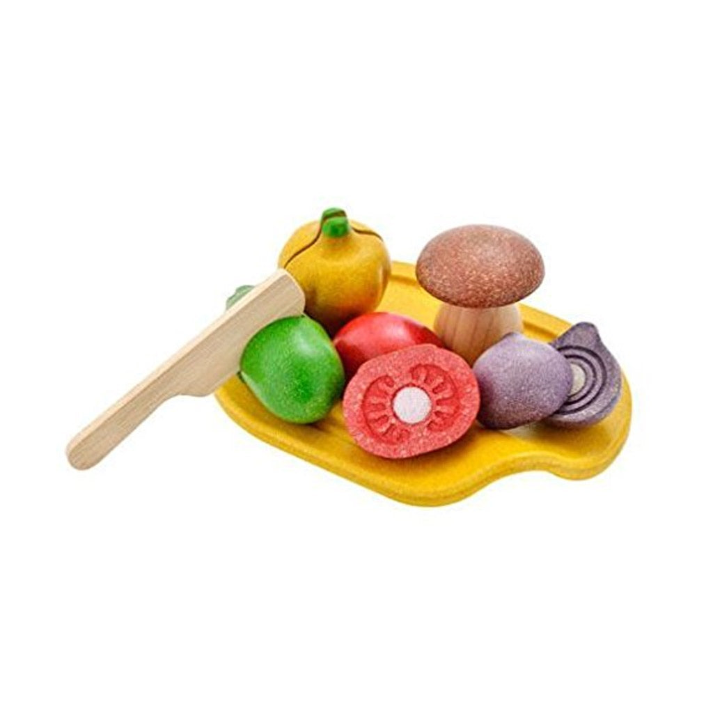 Plan Toy Assorted Vegetable Wooden Gift Set with a Yellow Plate Full of Colourful Vegetables like Onions Tomatoes Mushrooms at Hedgehoggifts.com