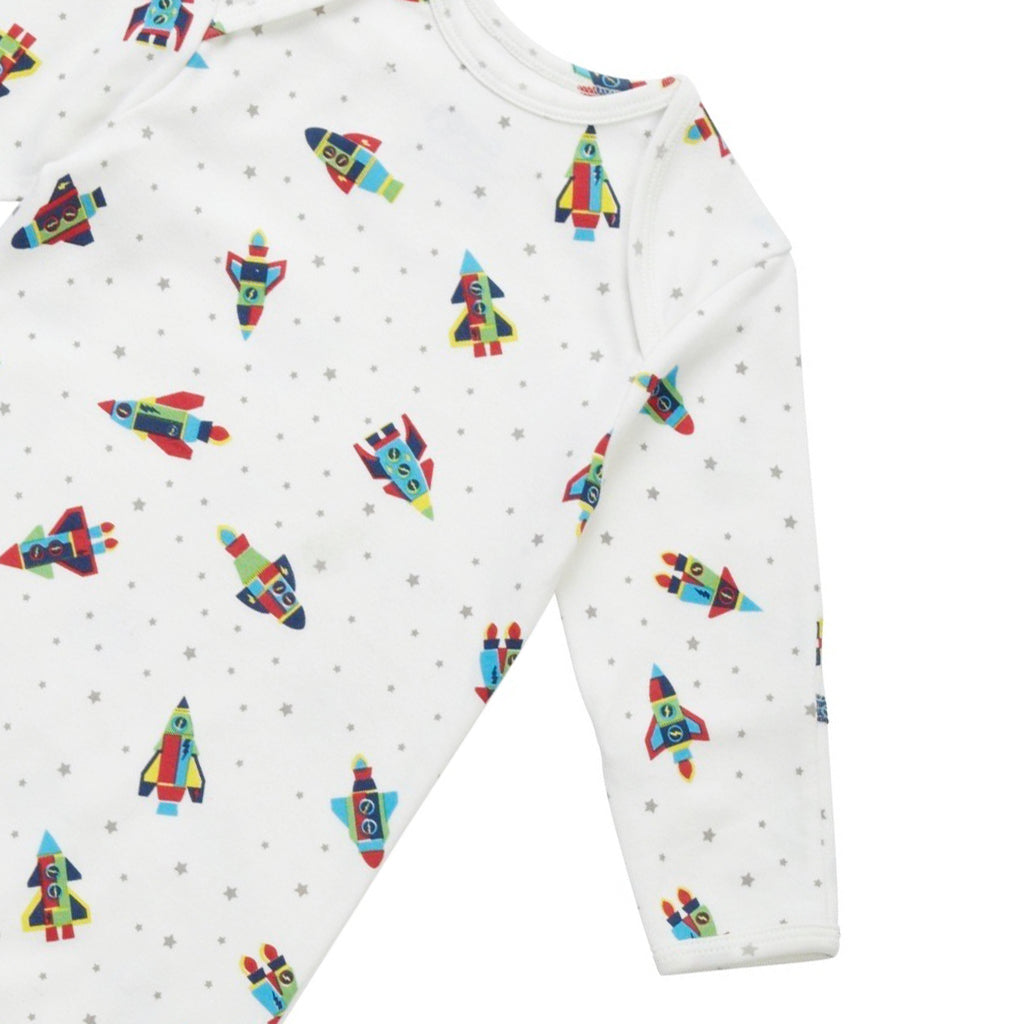 close up a lovely footed playsuit, also known as a romper, featuring Rockets and stars in grey from Piccalilly Organics