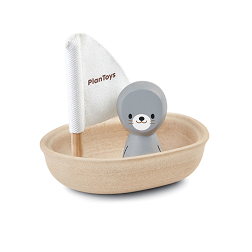 Eco Friendly Plan Toys bath time fun with wooden toy sailboat with a little seal sailor