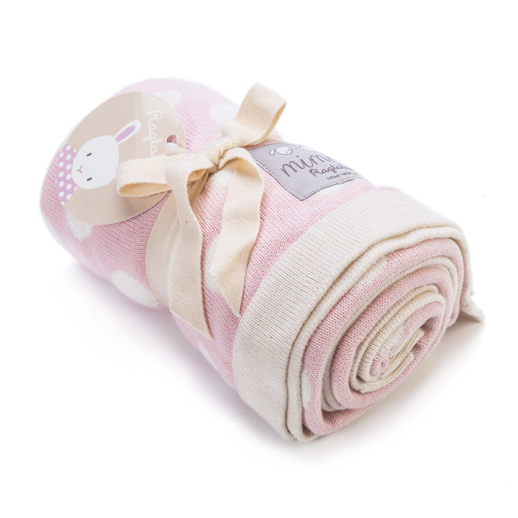 Rolled up luxury double sided organic blankets have been knitted in beautiful two-tone colours